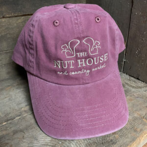 purple hat with tan nut house and country market logo