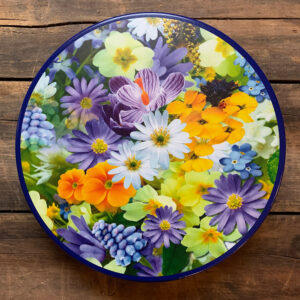 Tin with blue, purple, yellow and white flowers