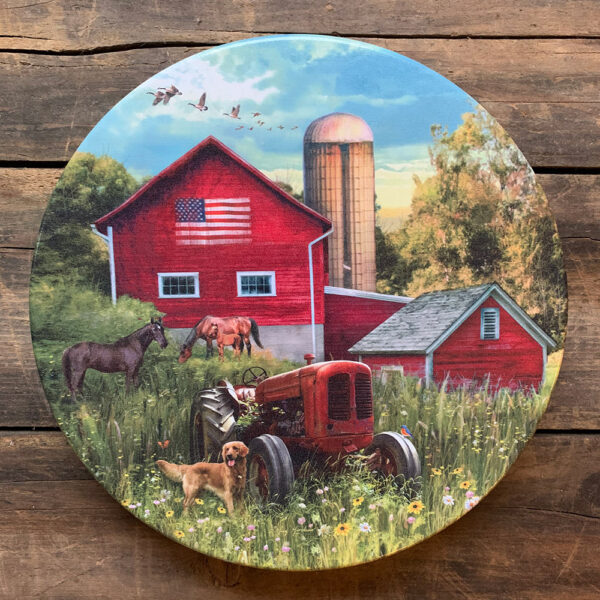 Tin with image of tractor in field with red barn behind