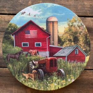 Tin with image of tractor in field with red barn behind